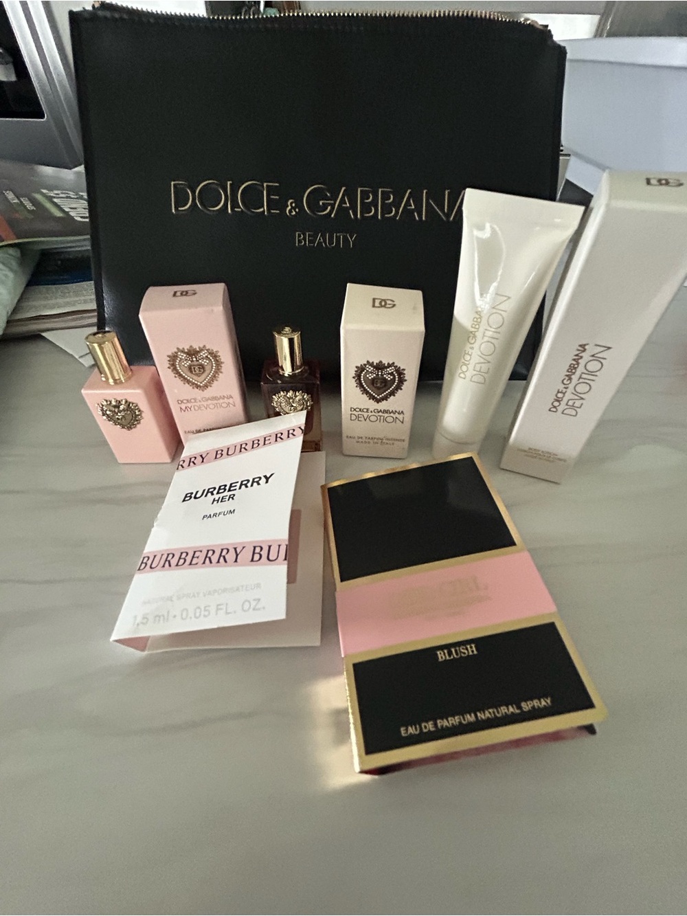 Dolce & Gabbana Black Cosmetic Pouch with Gold Logo and Mini Skincare Boxes